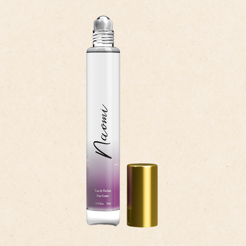 "Naomi Eau De Parfum Rollerball by Regal Fragrances – a convenient 0.33 fl oz (10ml) perfume inspired by Flower Bomb, featuring a blend of fresh rose, jasmine, and patchouli. Housed in a sleek rollerball applicator for precise application, perfect for on-the-go touch-ups."